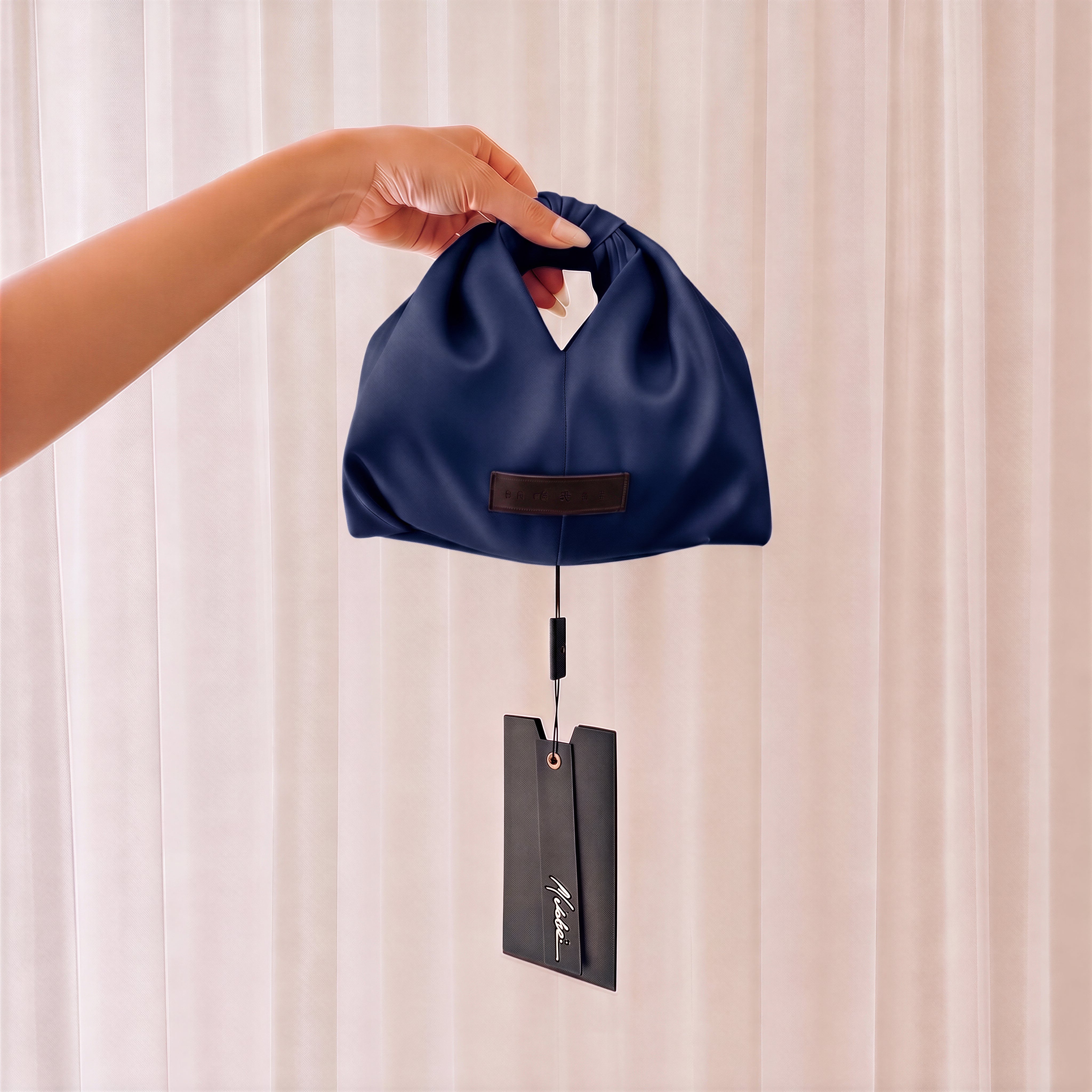 THE QUINN KNOT BAG
